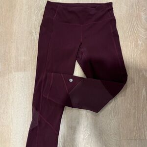 Lululemon capri length running leggings with mesh side and back detail.